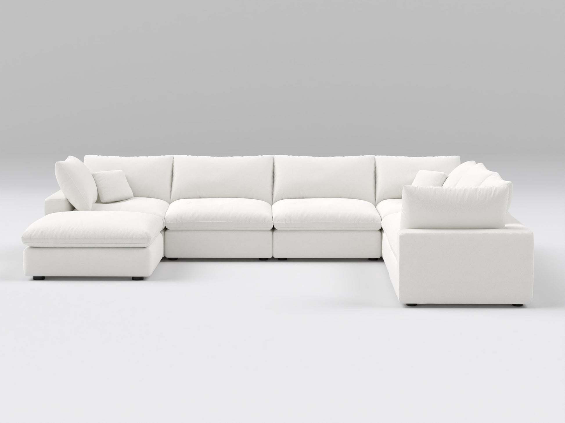 White sectional sofa on a gray background